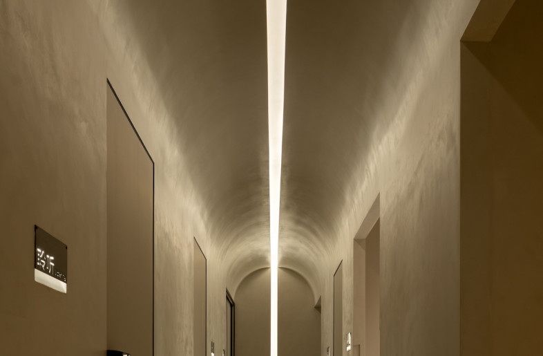 . Recessed lighting signals the space’s way finding. - Courtesy of Godot Design