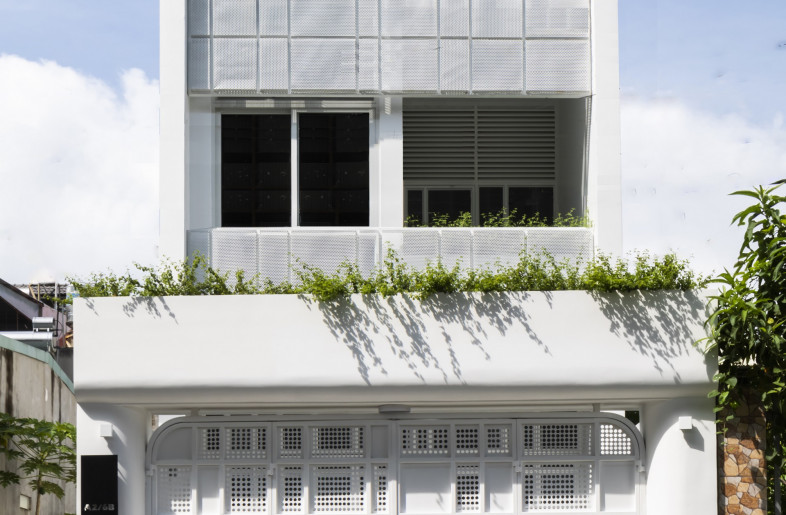Creative Architects (CTA) built J House up from an empty plot of land measuring 4 by 24 m in Biên Hòa. - Hiroyuki Oki