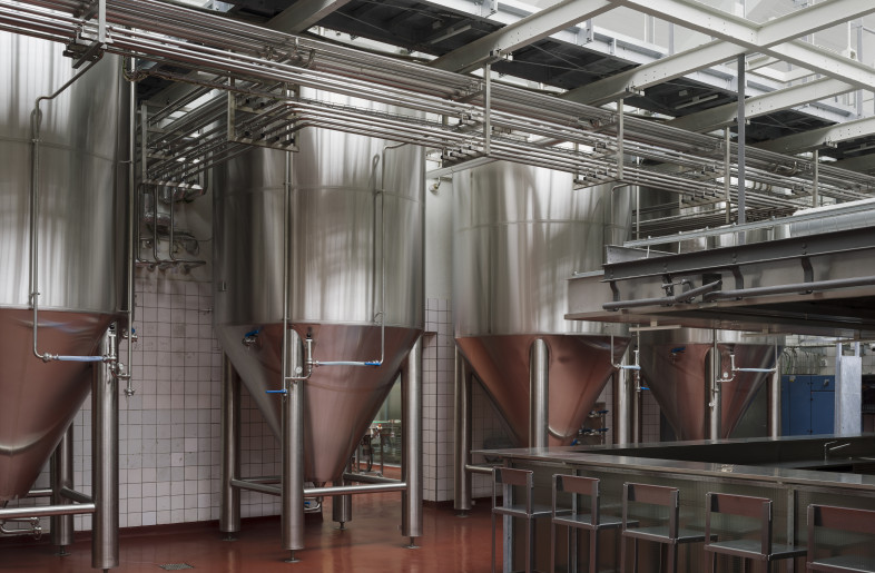 ‘The qualities of the original hall are emphasized by the positioning of the brewing apparatus, together defining the spatial layout and ambience,’ explain the architects. - Hampus Berndtson