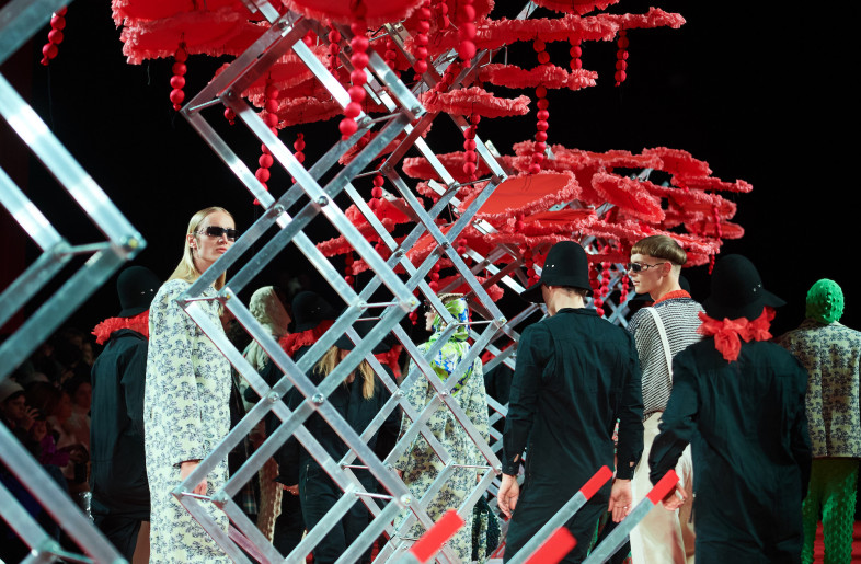 Seven portable mechanical installations – scissor lifts topped with red textile flowers – were the focus of the space. - James Cochrane