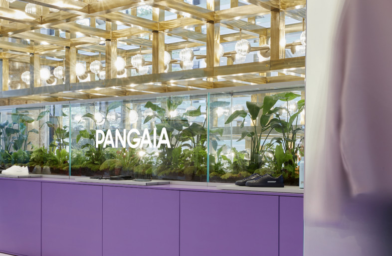 The designer drew on a lab aesthetic for the materials science company with display fixtures and architectural elements made of clean-cut glass, aluminium and a circular material made from compressed recycled textile fabric. - Valentin Fougeray