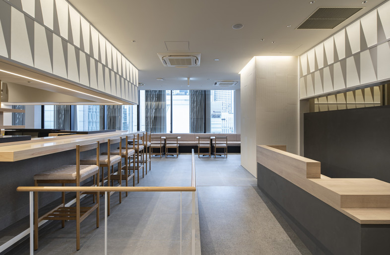 Temporally and/or seasonally responsive luminous walls are laid out above the counter area, behind the cash register, and in the rear private room. - Keishiro Yamada