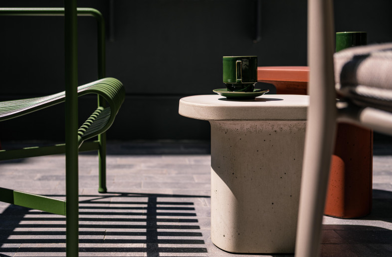 Hay ‘Palisade’ outdoor armchair and B&B Italia 'Erica ‘19' chair, with Pedrali 'Caementum' side tables for the outdoor terrace. - Kenneth Chao