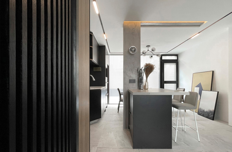 As in the open kitchen, the columns and beams are intentionally left in place to emphasize the relationship between structure and space. - Frank Lo