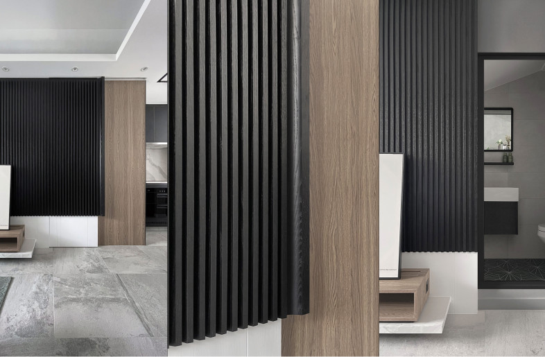 In addition to being decorative, it conceals the guest toilet underneath the stairs through a sliding door. By extending the visual effect of the feature wall, it enhances its aesthetic appeal. The handle is made of the same material as the door. - Frank Lo