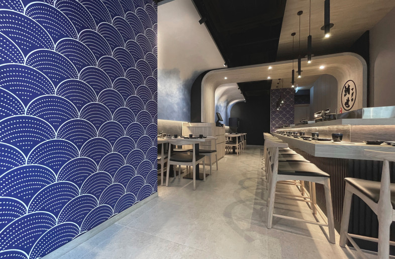 The wall to the left is covered with dark blue wallpaper that resembles the waves of Ukiyo-e art. The atmosphere is intimate and charming. - Frank Lo