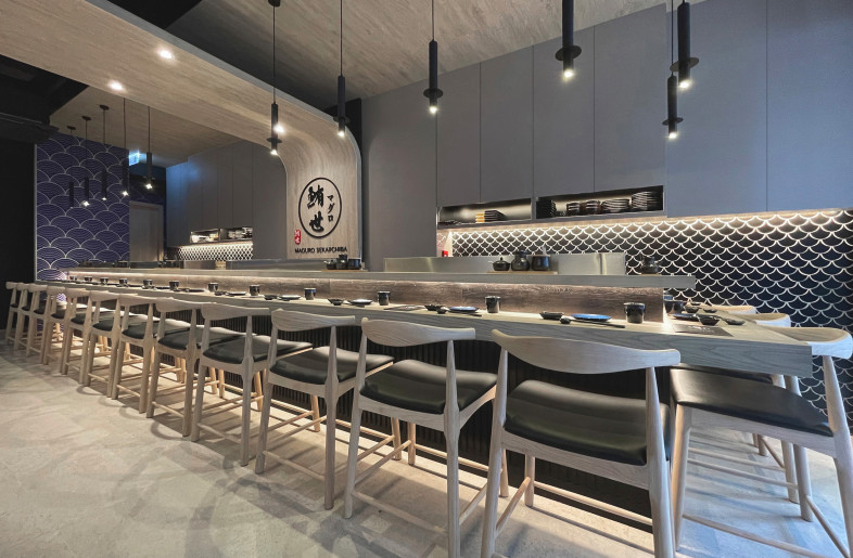 Among the restaurant's other features is the bar area, where the sushi chef converses with customers while preparing dishes. - Frank Lo