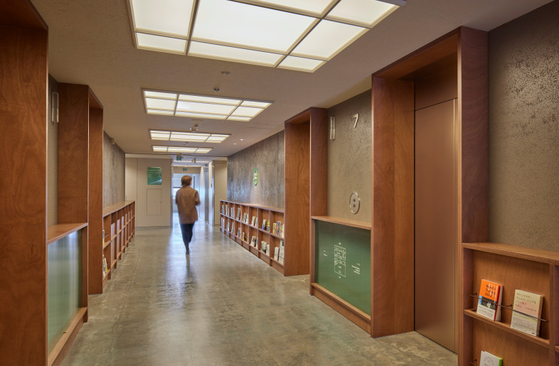 Elevator Hall. From the moment you arrive on the floor, we want you to feel a sense of excitement. Once you get off the elevator, the experience begins as if you are walking through a bookshelf. - FUMITO SUZUKI