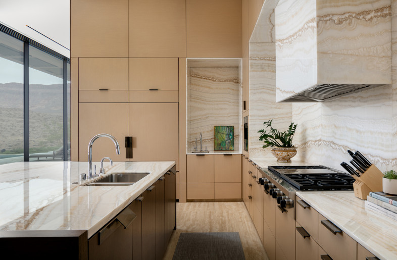 Kitchen with views to rear pool deck and surrounding foothills. - Stetson Ybarra