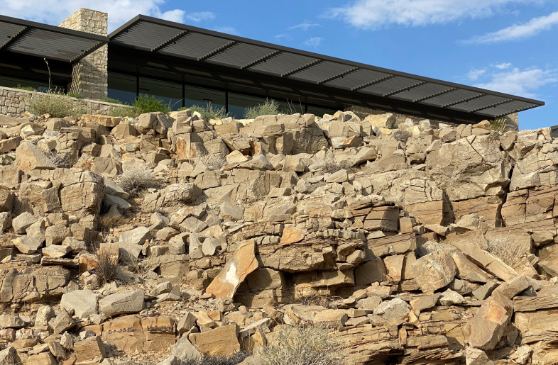 Great care was taken to preserve the geological edge of the site  where it meets the building. - Daniel Joseph Chenin, Ltd.
