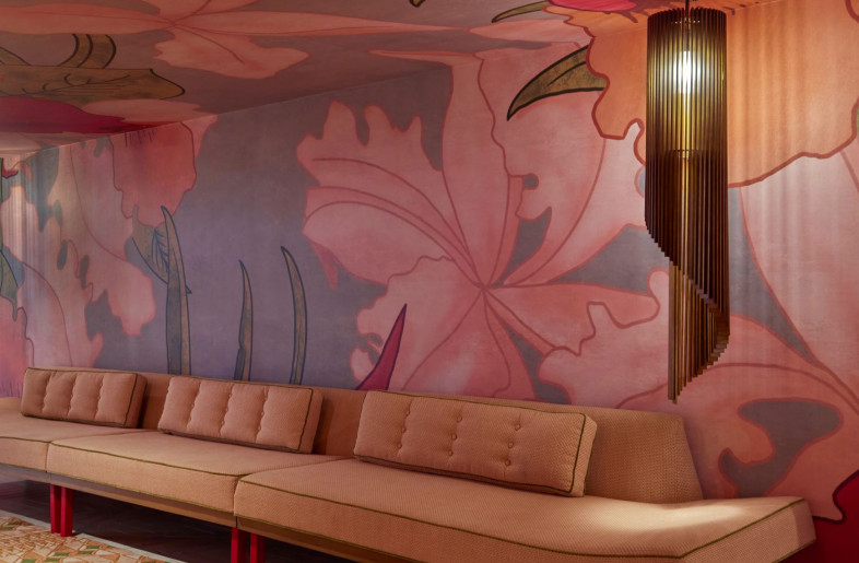 Overscale hibiscus flowers and lush fern leaves will adorn corridor walls, while beachy-pastel corals and pinks stipple the custom runner. - Mike Schwartz