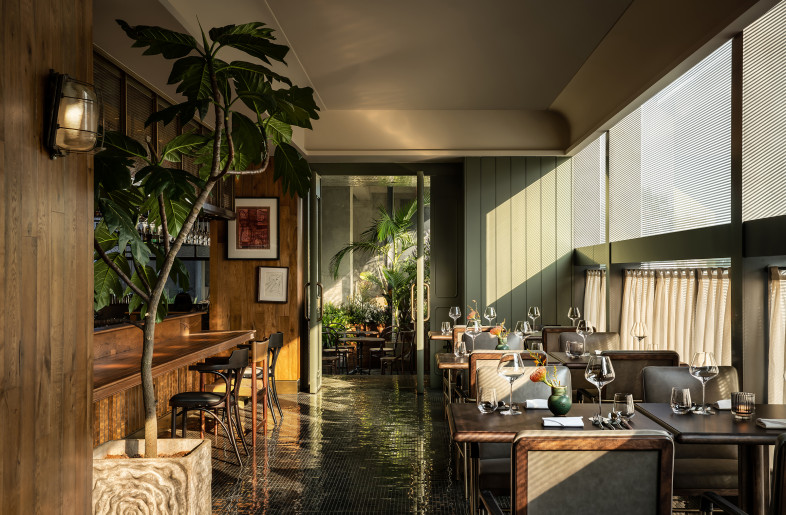 The interior and exterior walls of the restaurant, clad in similar materials, intensify the sensory connection to the materials, thereby enhancing the patrons' physical connection to the culinary philosophy. - Ting Wang