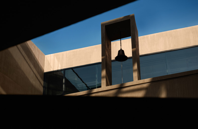 Looking between the gap of the atrium staircase towards the bell tower - YinXiang Photography