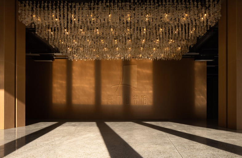 The back foyer - exhibition area with custom handmade chandelier with local seashell - YinXiang Photography