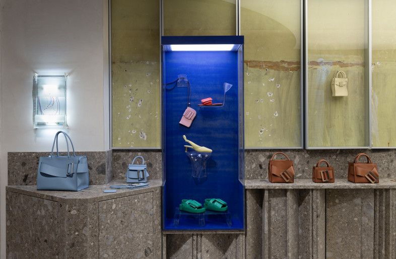 BOYY’s colourful collection framed by blue display boxes, hangs next to a custom made lamp which echoes the shop's curved window - BOYY