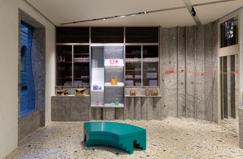 a see-through storage cabinet and an emerald-green seating piece, especially created by FOS for BOYY - BOYY