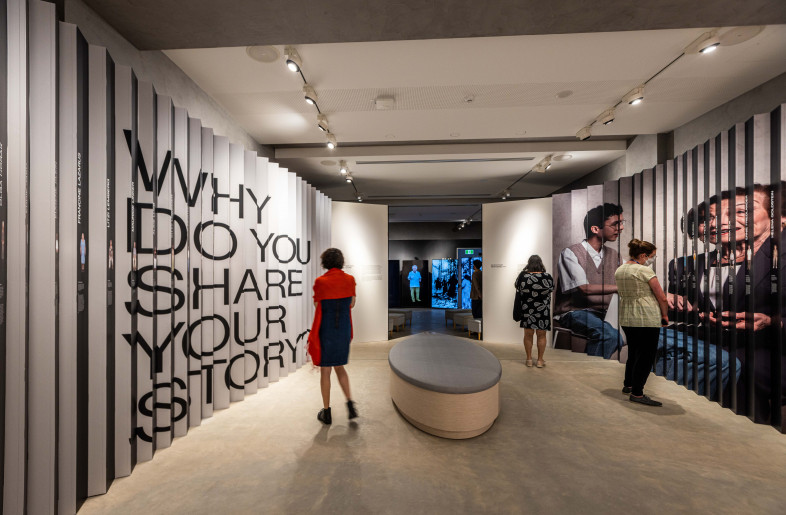 Lenticular with large graphic and images on one side, and specific stories on the other - Sydney Jewish Museum