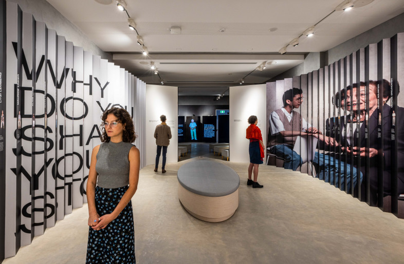 Lenticular with large graphic and images on one side, and specific stories on the other - Sydney Jewish Museum