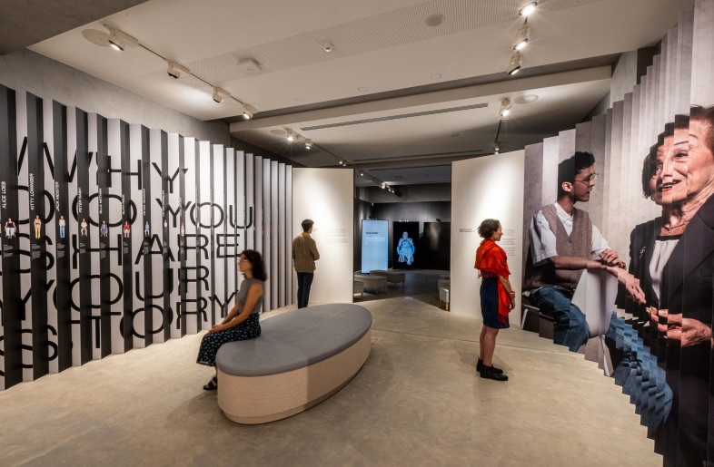 Lenticular with large graphic and images on one side, and specific stories on the other - Sydney Jewish Museum