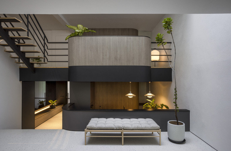 Triple Volume Mezzanine Living Space — designed as an important central space that allows for visual connection between the staggered floor plates in the house, allowing for open visual connection and communication across the levels between the different pockets of spaces. - Triston Yeo