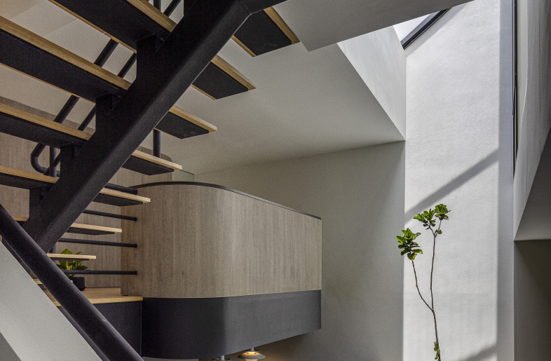 Triple Volume Mezzanine Living Space — built upon the typology of split levels, this space features a skylit atrium, communal lounge, and dry kitchen. - Triston Yeo