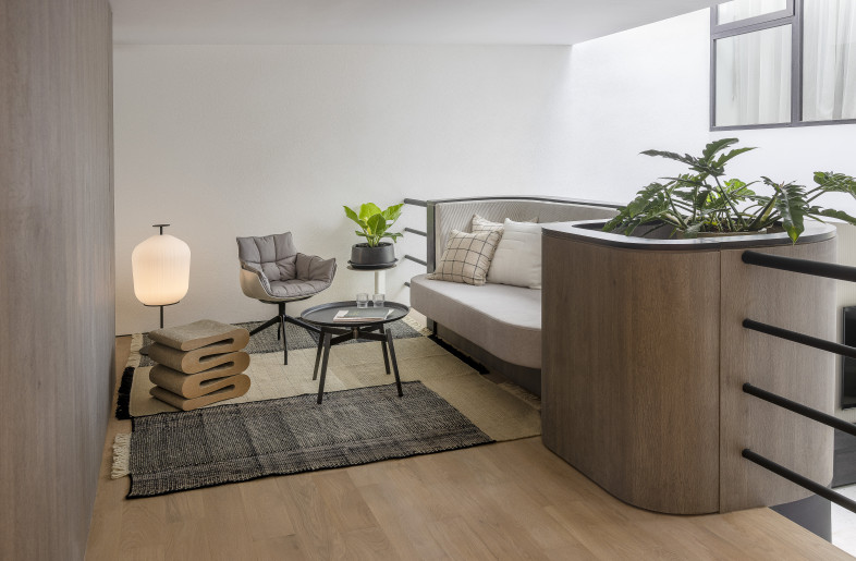 Mezzanine Lounge – situated beyond the curved parapet wall of the living space. Highlighted in timber cladding and overlooking the skylit atrium. - Triston Yeo