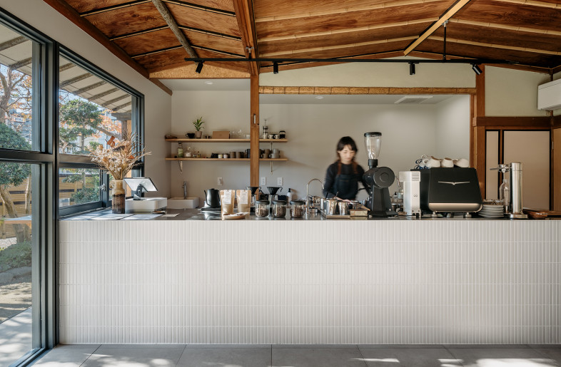 Newly renovated walls and counters are white, contrasting with the existing old parts. - Yoshiro Masuda