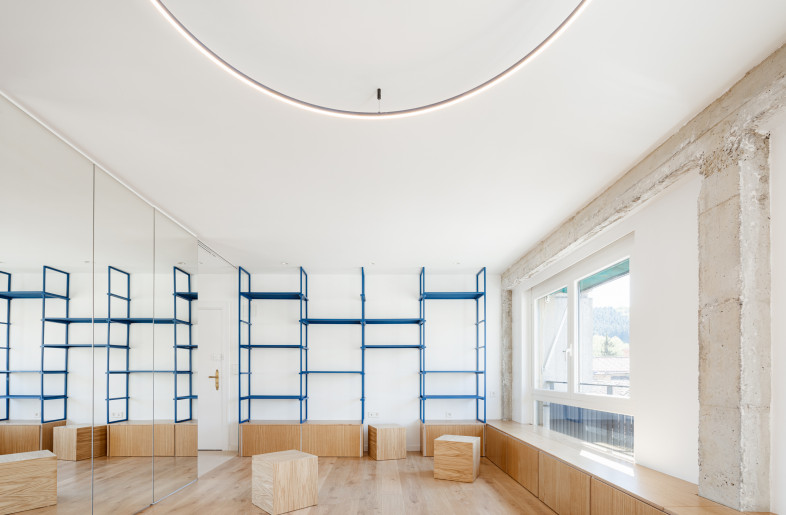 The reflective surface connects the spaces and makes it feel open while still ensuring each space has its own functional identity. - Aitor Estevez