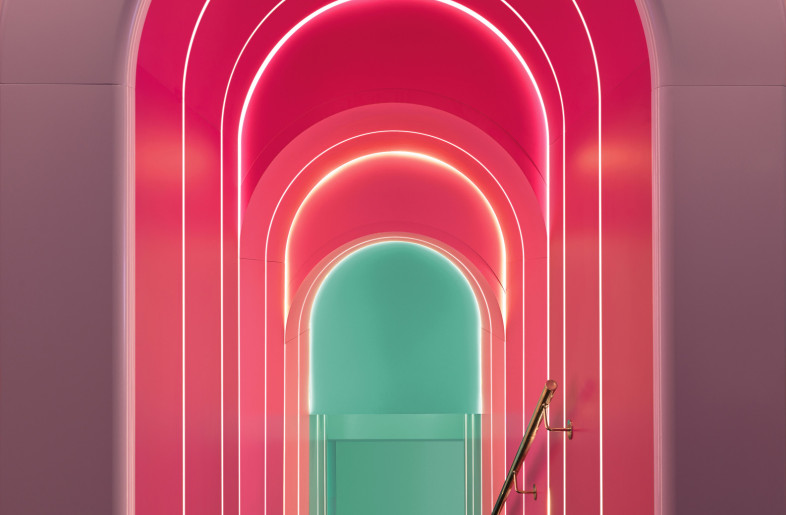 A kaleidoscopic tunnel of coloured arches chased down towards the magical world of Alice, in which everything arouses amazement. - Matteo Piazza