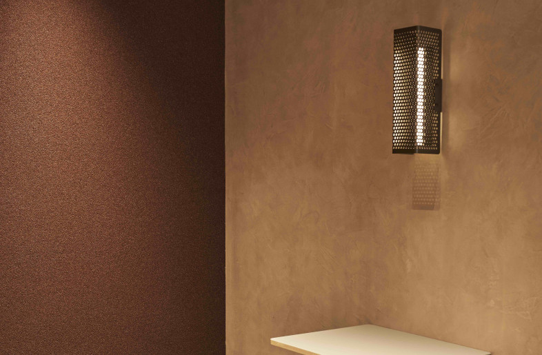 Plastering creates a grainy texture by crushing marble, and mixing stone and soil to create new textures. By using two different types of plastering, we create a sense of profoundness and solemnity, as well as the warmth of a cave lit with fire. - KEI OHNAKA