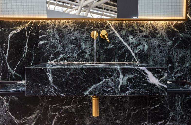 Front view of suspended marble sink with brass mixer taps. - Giuseppe Suma
