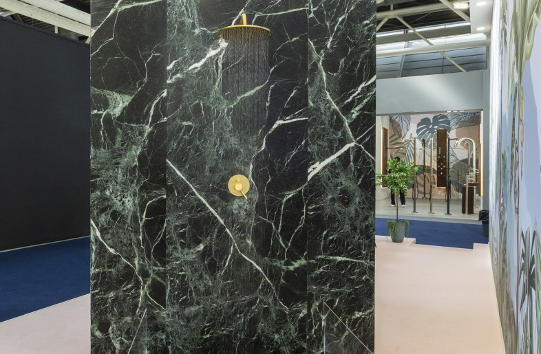 The shower is located on the side opposite the sink and consists of a chrome shower head and related marble shower tray. - Giuseppe Suma