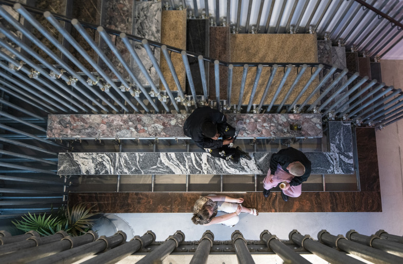 At basement level the treads of the stairs extend allowing flexibility for merchandise opportunities or seating . - Louise Melchior