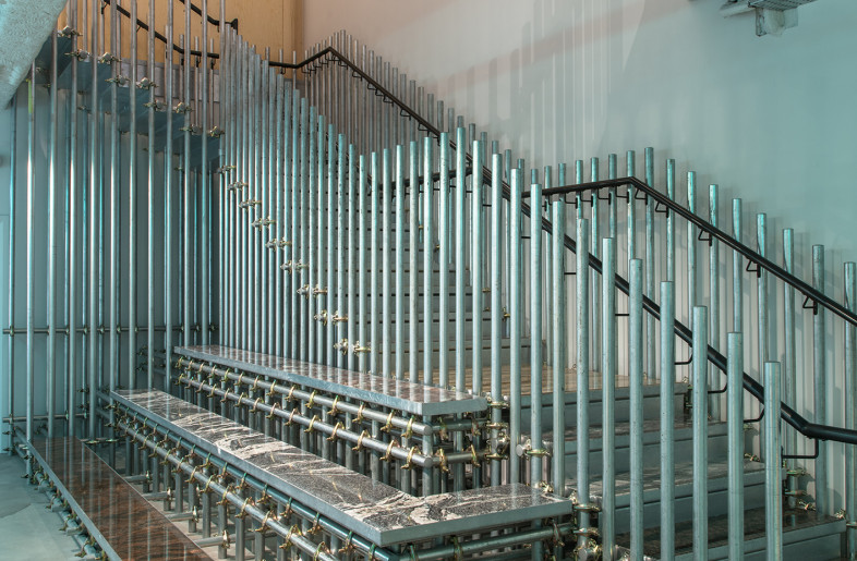 The bespoke scaffold staircase is an arresting centrepiece to the space. - Louise Melchior