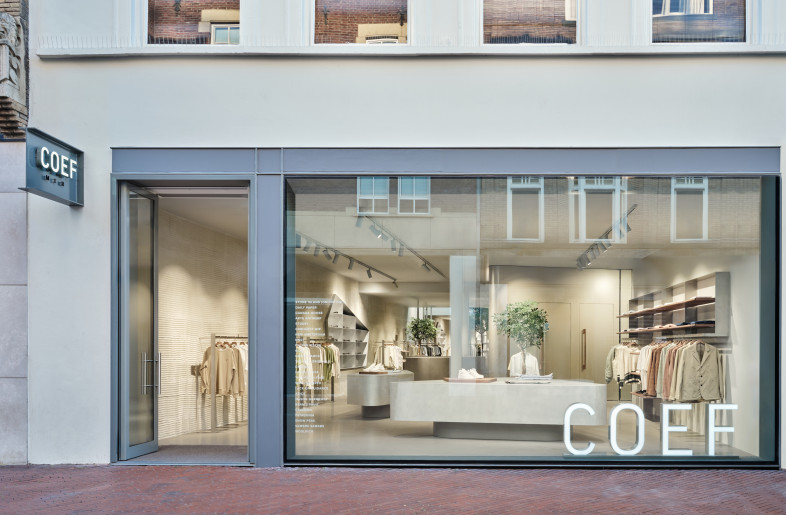 store facade with freestanding block sign - Maarten Willemstein