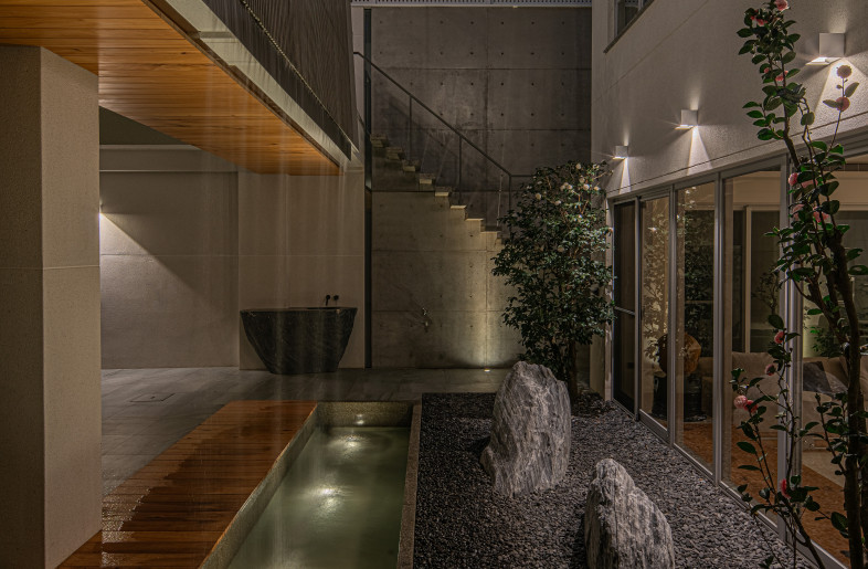 The water curtain is the soul of the building, featuring multiple environmental control property. A specialized stairway leads to the second-floor terrace. - Dirk Heindoerfer Photography