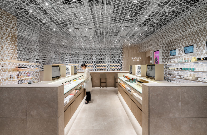 Perfume Area　 Created a skeleton ceiling considering the architecture a bare skin without any makeup and decoration. The lighting fixtures are installed as if the light leaks through the gaps of the grid patterns. - Shanghai Sizhu Photography Ltd.