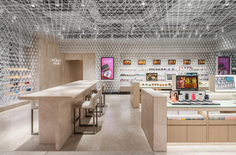 Perfume Area　 The perfume tester bar has a face-to-face counter where the concierge can assist customers to find their favorite perfume. A private salon for facials is set in the back of the store. - Shanghai Sizhu Photography Ltd.
