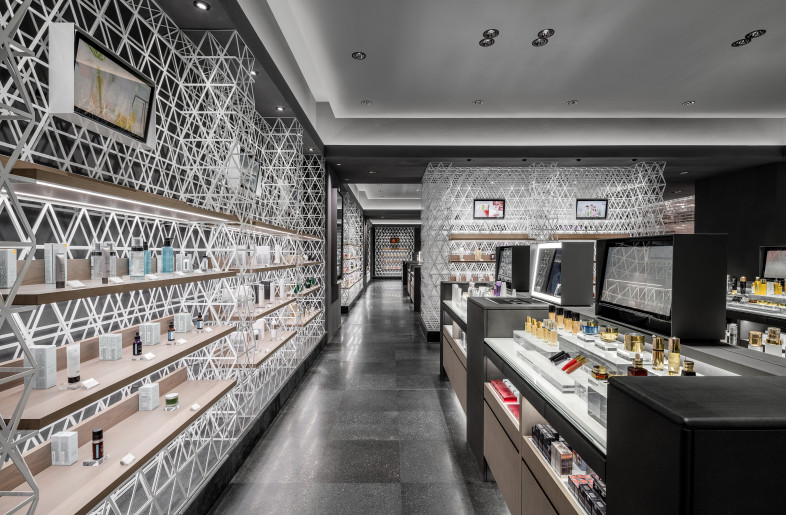 Cosmetic Brand Area　 Although the space was given to each brand as a tenant, the overall environmental design was created with unified grid and fixtures. The grid loosely connects brand sections. - Shanghai Sizhu Photography Ltd.