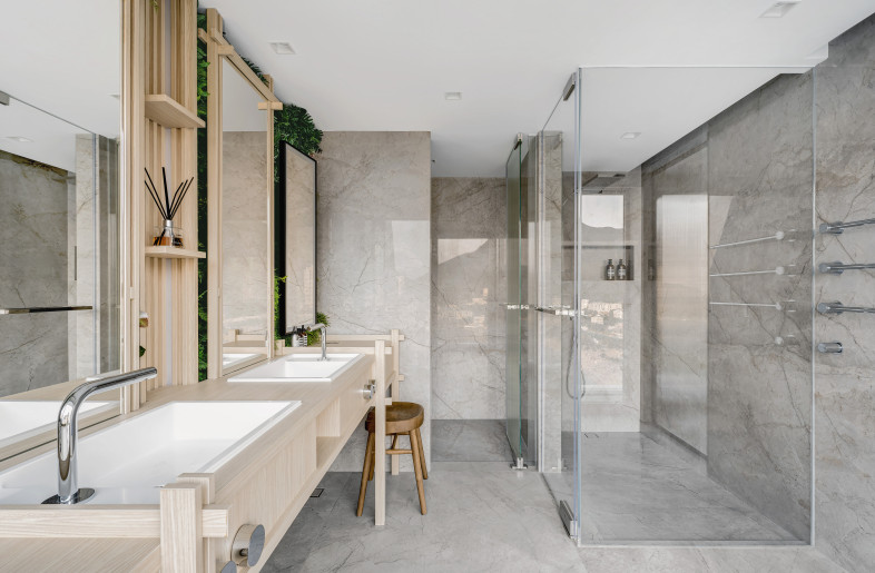 The suite is completed with a spacious bathroom and walk-in closet. - Millimeter Interior Design Limited