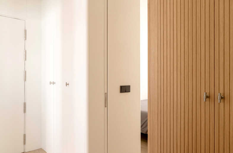 Sliding doors are hidden in the custom made cabinetry - Carla Capdevila