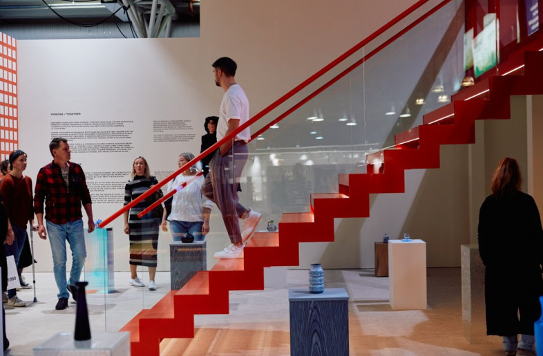 The neutral space was contrasted by a red staircase that lead to a lofted, monochrome gallery space. - Eeva Suutari