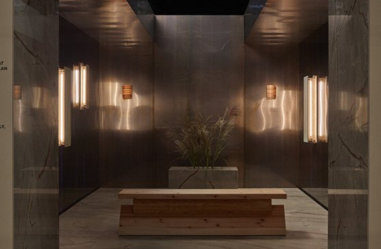 An enclosed room with silver mirrored walls and soft recessed light fixtures created the setting for a relaxing soundscape. - Katri Kapanen