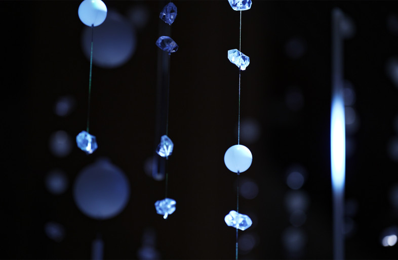 The objects suspended from the ceiling are of two types: spherical and crystal. - WOW