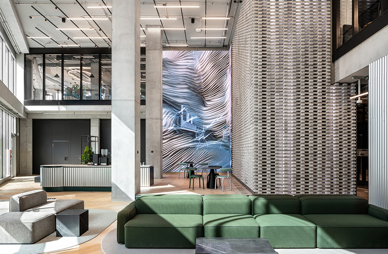 Eye catcher in the foyer: a seven-metre-high LED and brick wall. - Philip Kottlorz
