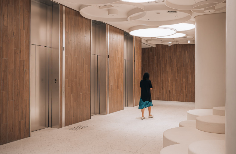 Sea of white clouds, featured by the ceiling’s light fixtures and the sofas’ shape - Eric Ho