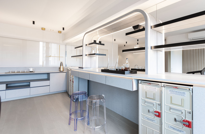 The home bar design features a combination of linear and curved lines that flows naturally. - Clifton Leung Design Workshop