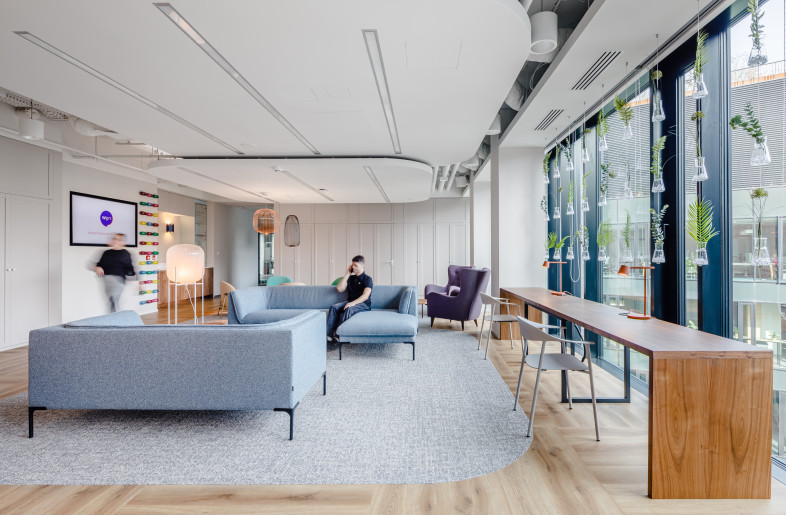 The layout of the workspaces is thoughtfully designed to facilitate a seamless transition from traditional, enclosed offices to an open, community-oriented environment. - Adam Grzesik