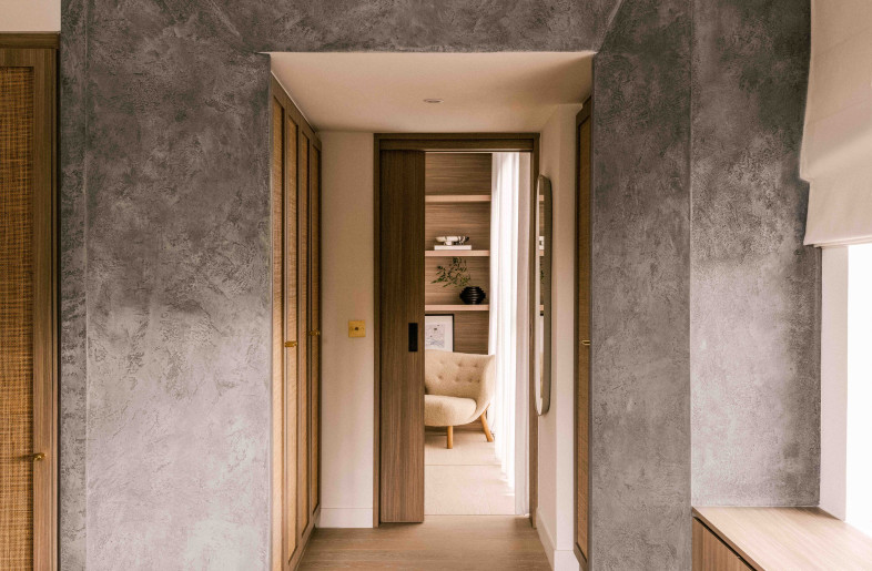 A hallmark of VC Residence lies in the statement plaster portal frames that adorn the various spaces, lending an air of architectural sophistication. These frames not only serve as structural elements but also create a sense of depth and visual interest, captivating the eye and inviting exploration within the space. The portals lead from one space to another, while walls were removed to create a looping path throughout the apartment. - Common Studio