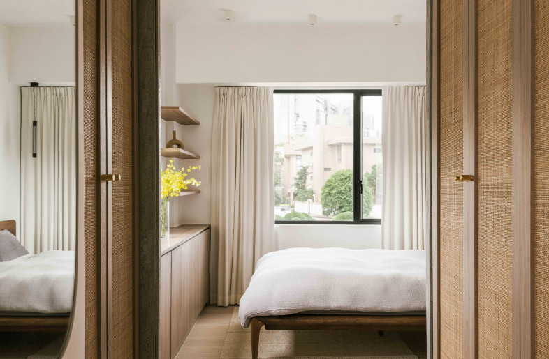 Master bedroom with rattan wardrobe doors - Common Studio